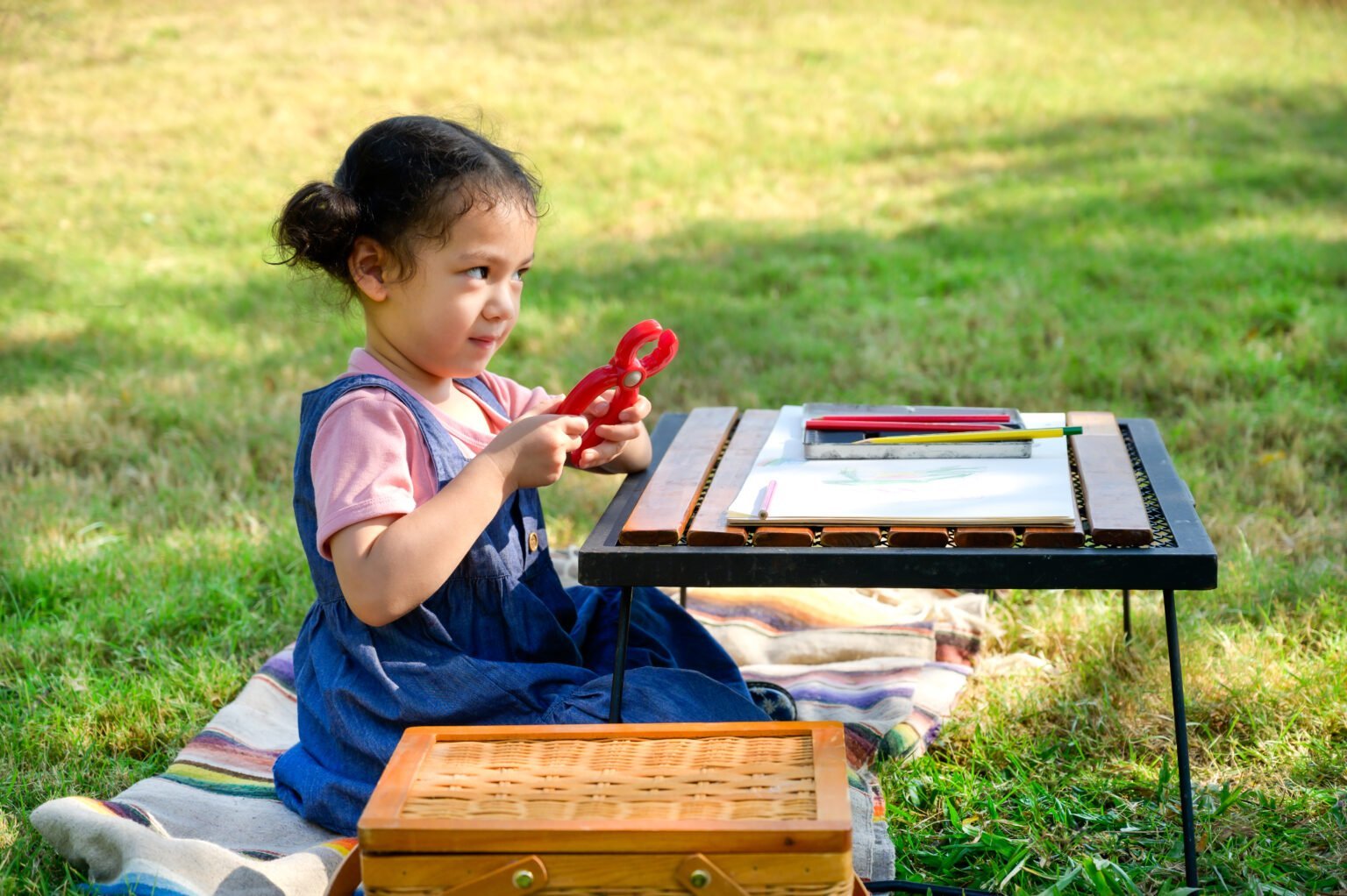 vecteezy_a-little-girl-is-sitting-on-the-cloth-and-playing-a-toy_7260196-1536x1022